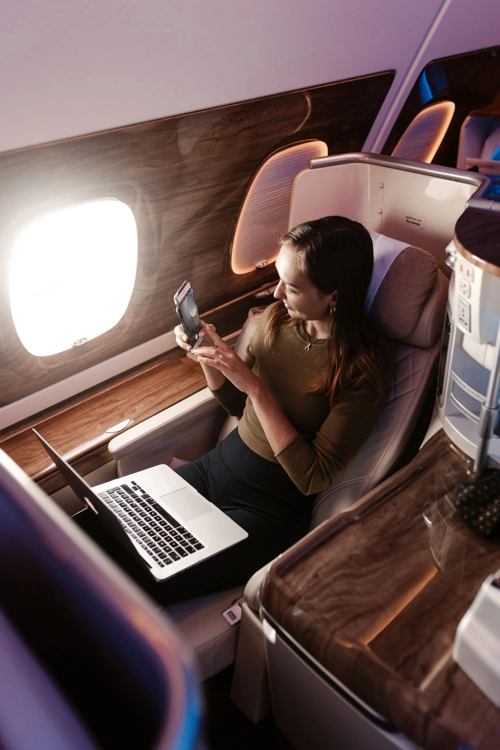 A traveller enjoying a premium airline cabin
