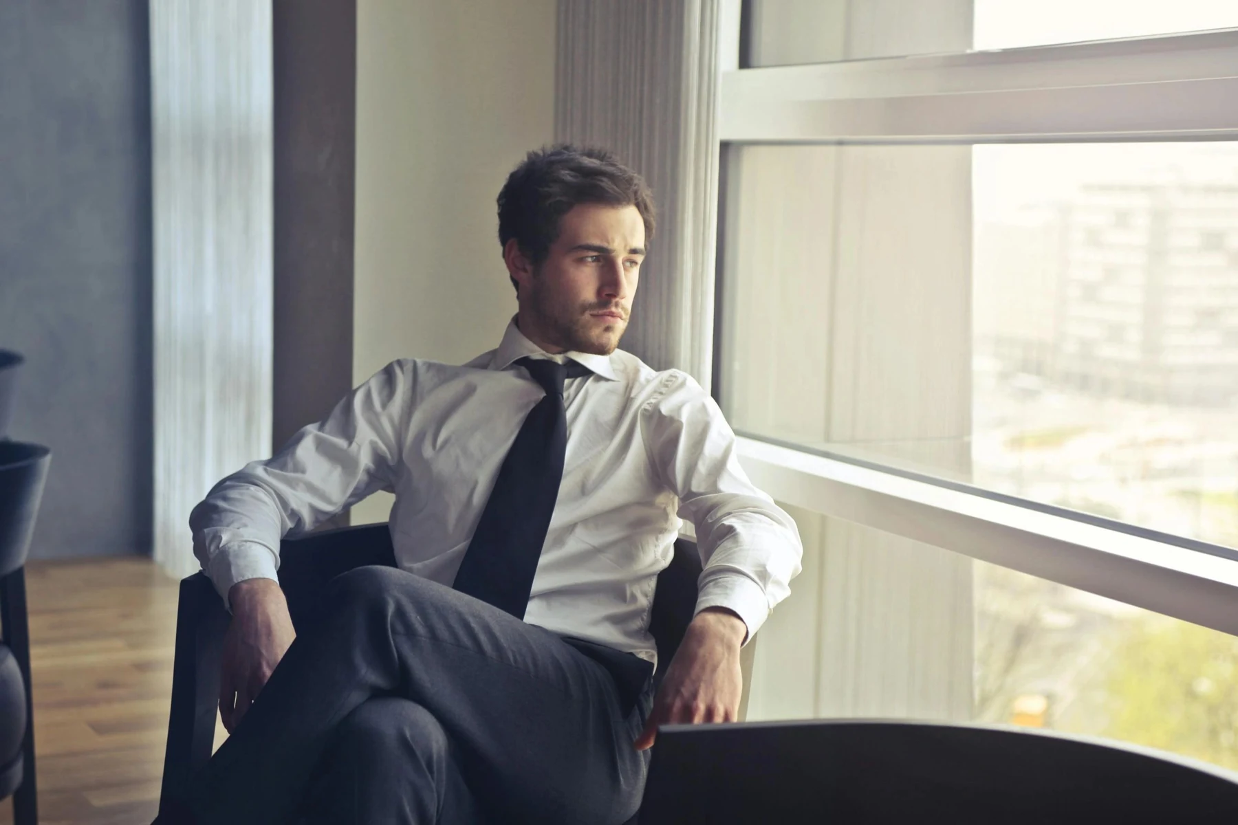 Business traveller taking a quiet moment beside a window