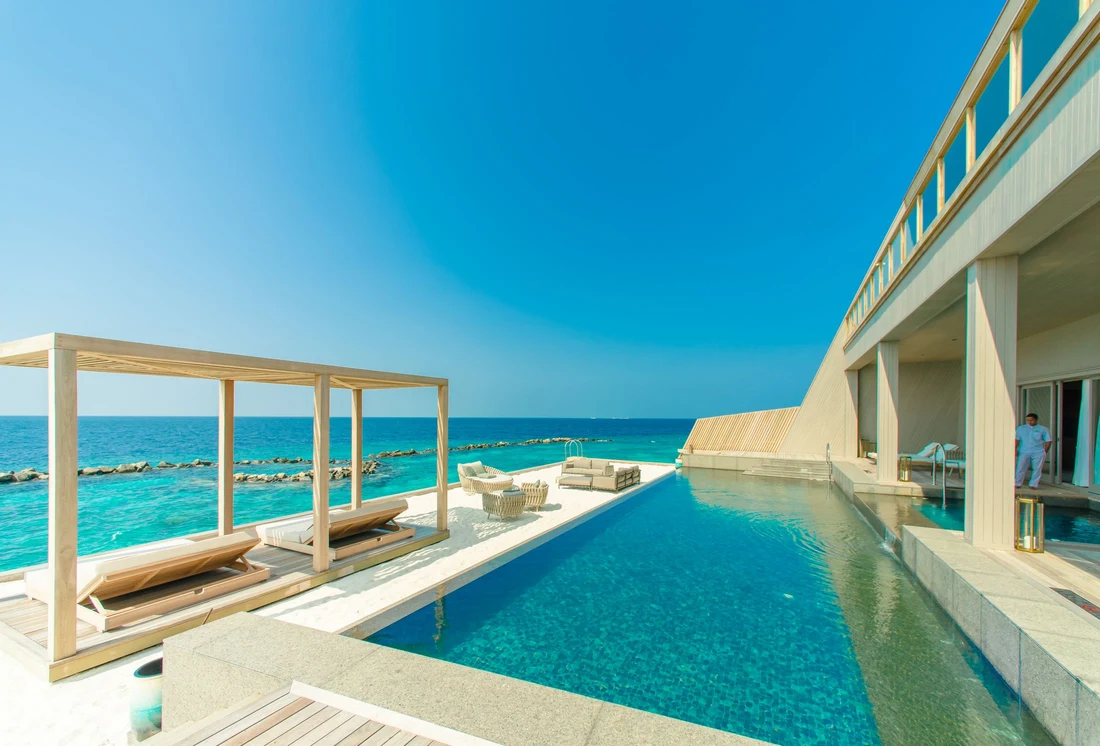 Illustrative hotel pool and outdoor lounge